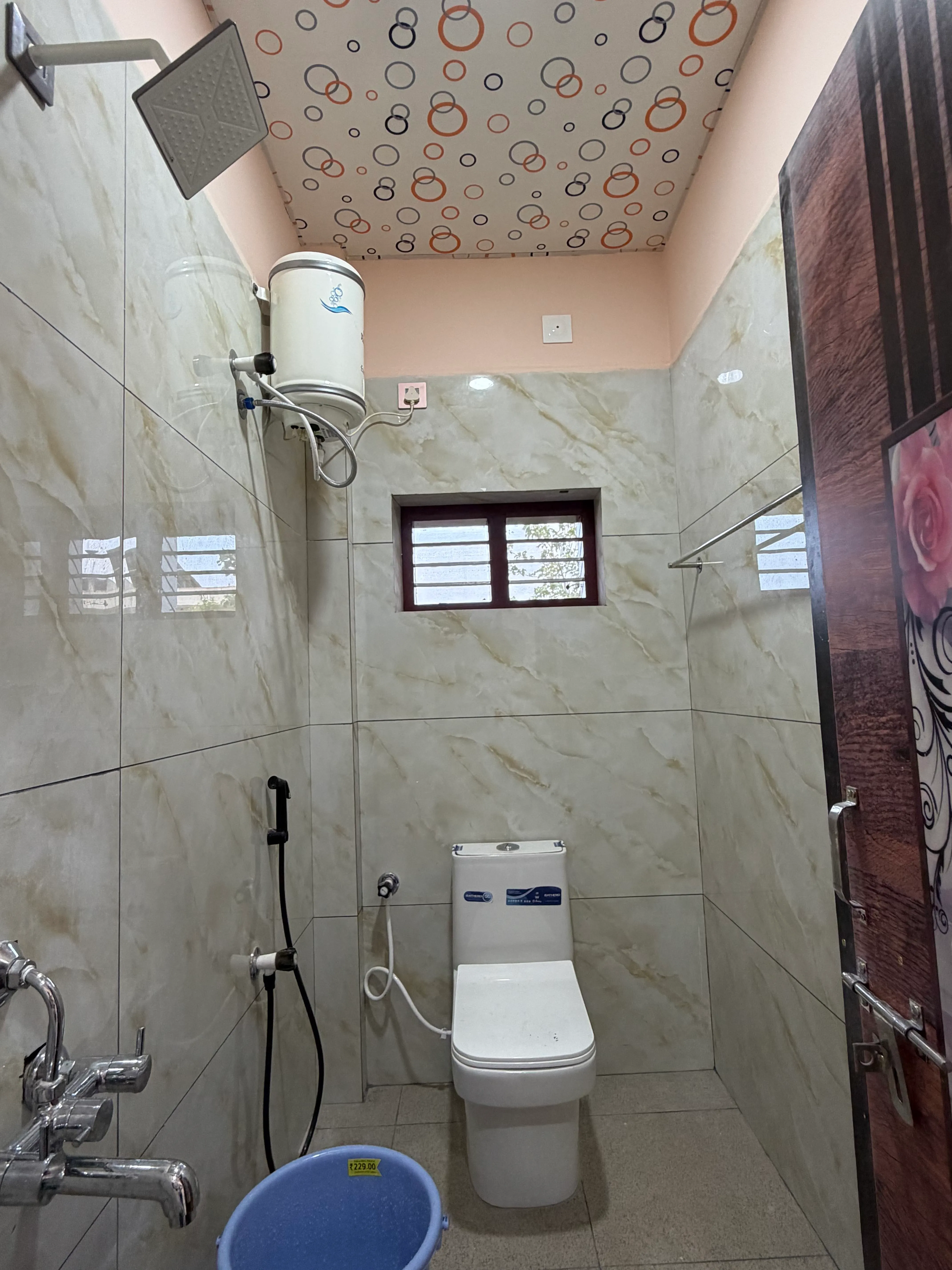 Clean modern bathroom with tiled walls and shower